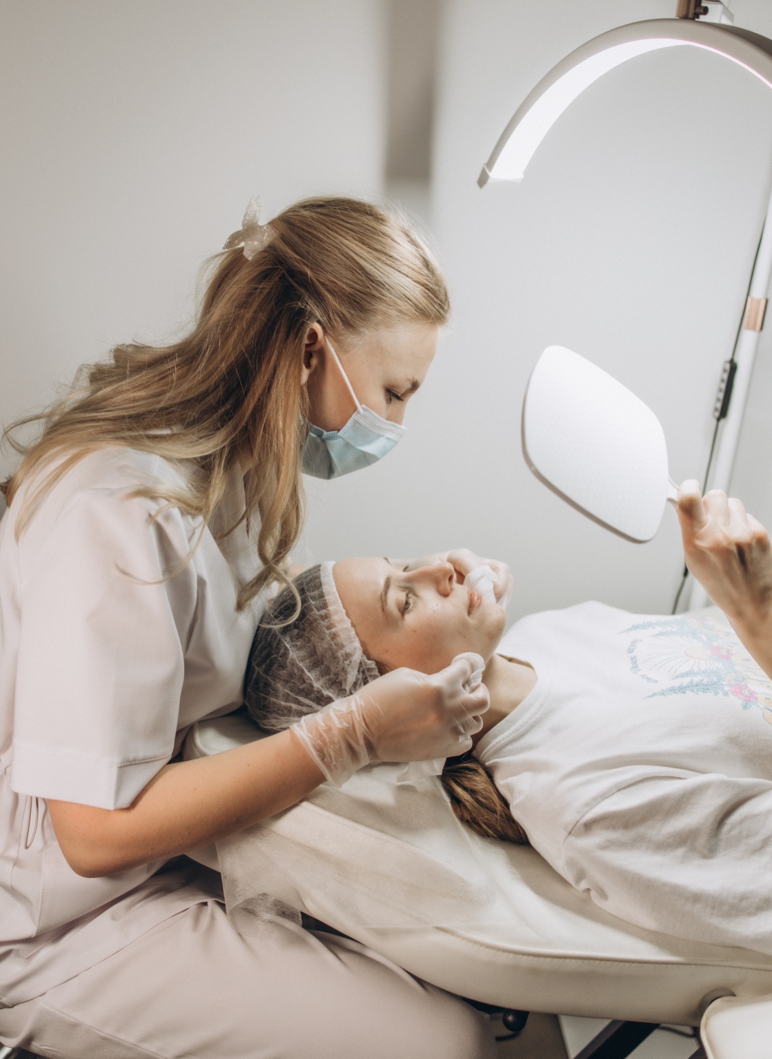 Olena performing a facial treatment at LÉN Skin Studio
